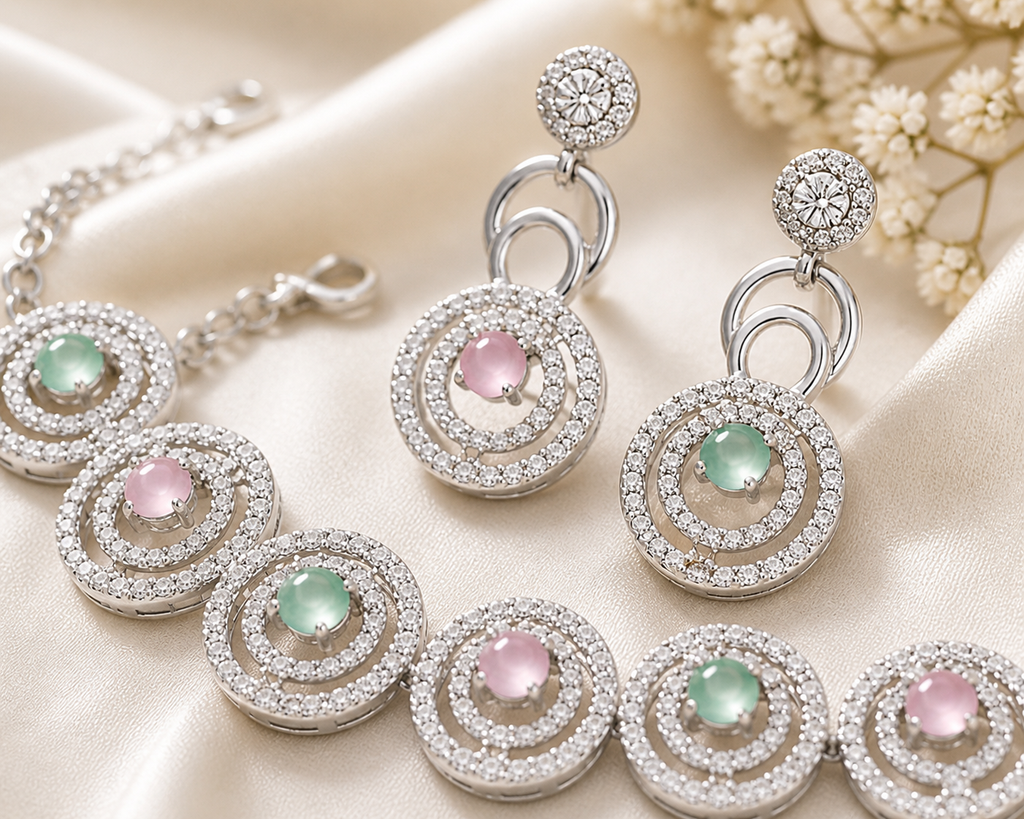 Silver jewelry set with gemstones on a beige fabric background